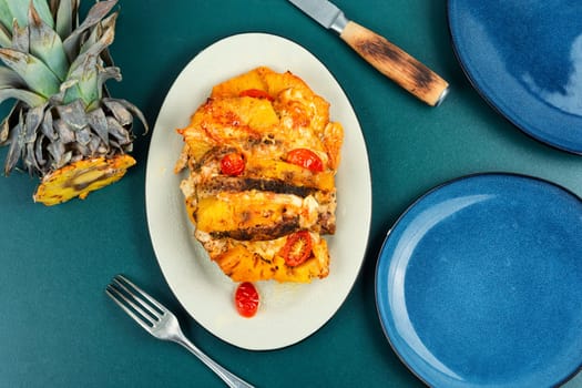 Pork steak with pineapple on plate
