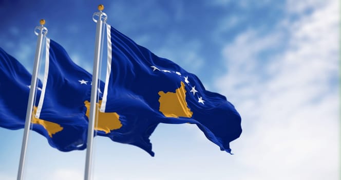 Three national flag of Kosovo waving in the wind on a clear day. Six white stars above a golden map of Kosovo in a blue field. 3d illustration render. Selective focus. Fluttering fabric