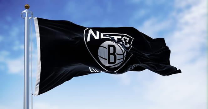 Flag of Brooklyn Nets waving in the wind on a clear day. American professional basketball team, member of the Atlantic Division of the Eastern Conference. Illustrative editorial 3d illustration render