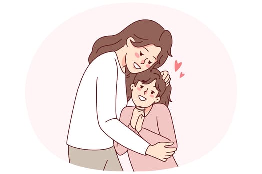 Happy mother hugging small daughter