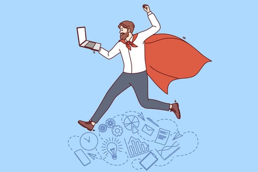 Business man in superhero cape holds laptop and rejoices at team corporate achievements. Manager with leadership qualities near symbols of productive work and successful completion of business tasks