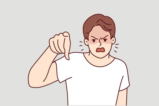 Angry man points finger at screen and screams furiously, blaming you for problems and urging to apologize. Angry guy is having nervous breakdown or trying to find someone to blame for own failures