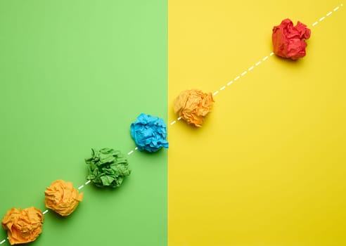 Crumpled paper balls follow the leader along one trajectory