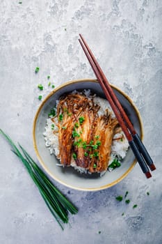 Rice with enoki mushrooms and chives. Asian vegan diet meal.