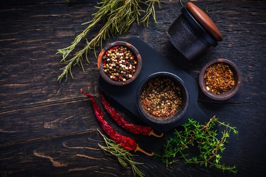 Cast iron spice mill for pepper, salt and herbs with ingredients