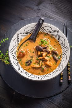 Homemade miso mushroom soup with coconut milk, with assorted edible mushrooms
