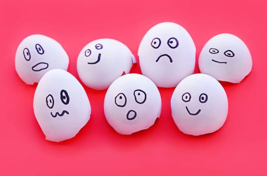 Eggshells with painted faces with different emotions