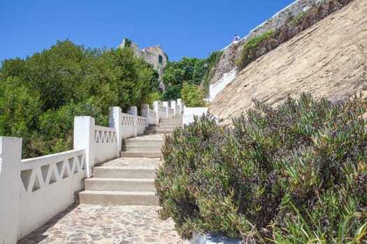 Vila Nova de Milfontes. little picturesque town on the Alentejo coast, Portugal. Stairs from pier to Barbaca Square