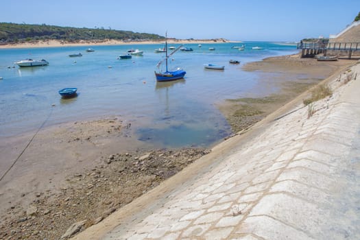 Vila Nova de Milfontes street. Little picturesque town on the Alentejo coast, Portugal. Marina and promenade