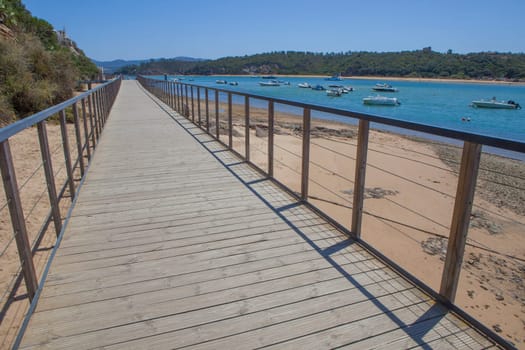 Vila Nova de Milfontes street. Little picturesque town on the Alentejo coast, Portugal. Rio Mira promenade