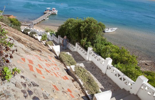 Vila Nova de Milfontes. little picturesque town on the Alentejo coast, Portugal. Stairs from pier to Barbaca Square