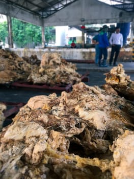 Latex Rubber, Rubber left over from the latex production process to be used to make other materials blurred background