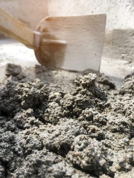 Close up Mixing of stone, cement, sand together to make a strong concrete floor, Construction concept