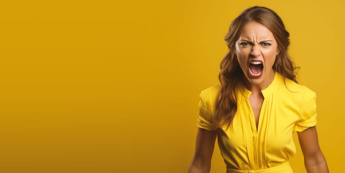 Portrait of an angry and frustrated young woman, screaming, aggressive face, negative emotion, yellow background