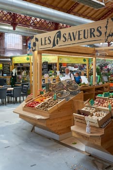 Market hall Marché couvert with regional food and delicacies in the old town of Colmar in France