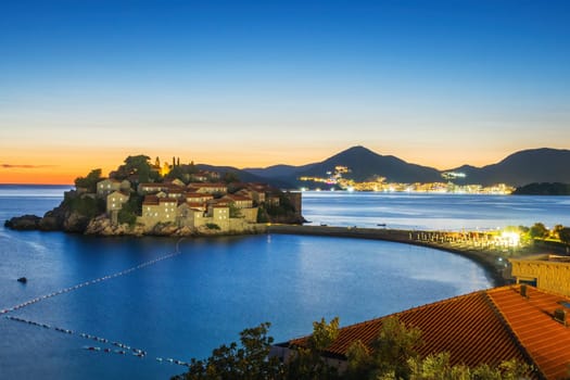 Sveti Stefan island in Montenegro, sunset on the seacoast. Popular travel destination