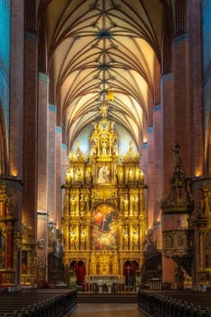 Beautiful golden and ornate altar of Church of the Assumption of the Blessed Virgin Mary, Cathedral Basilica in Pelplin, Poland
