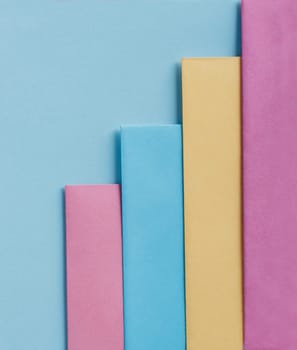 Trendy pastel colors in geometry shape flat lay. Colorful rainbow paper creative linear background. Abstract minimal vivid art design.