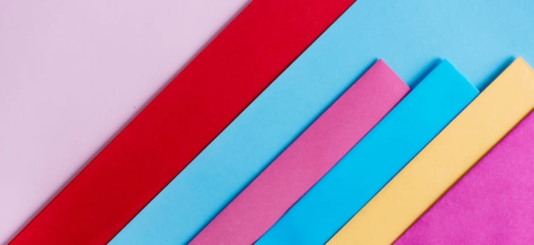 Trendy pastel colors in geometry shape flat lay. Colorful rainbow paper creative linear background. Abstract minimal vivid art design.