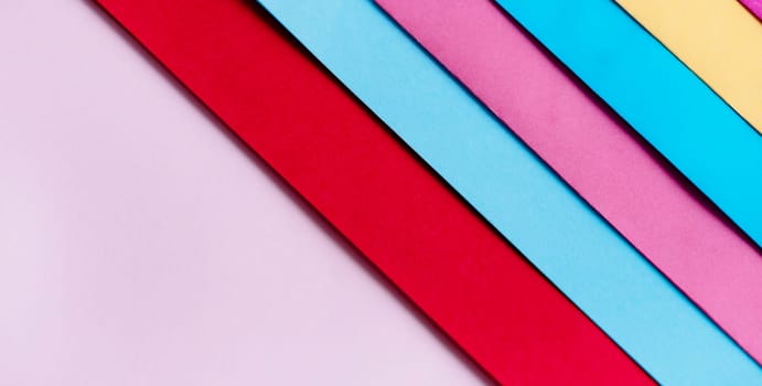 Trendy pastel colors in geometry shape flat lay. Colorful rainbow paper creative linear background. Abstract minimal vivid art design.