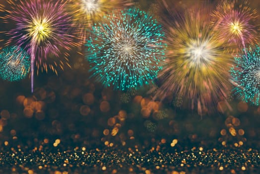 Abstract celebration background with colorful fireworks and bokeh lights. Holiday layout design for event party.