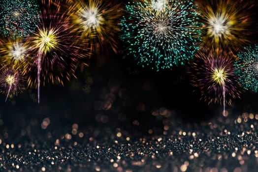Abstract sparkling fireworks design background for new year party and christmas celebration poster. Festive fire work light on dark bokeh backdrop with copyspace.