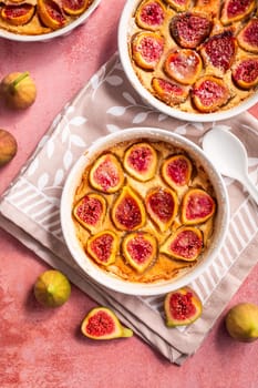 French fig clafoutis with almonds in baking form, glutenfree dessert