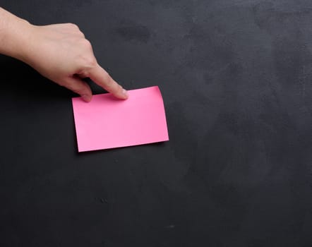 Representing the concept of searching for solutions and answers to questions, hand hold paper sticker