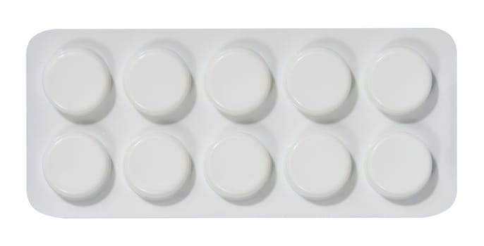 Round tablets in white plastic packaging, top view