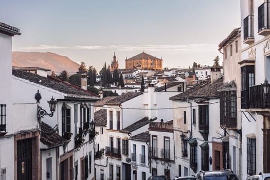 Views of the medieval village of Ronda with white Andalusian houses and the gothic style church of Santuario de Mar a Auxiliadora. Malaga, Spain