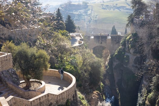 Panoramic view of hanging gardens of Cuenca over El Tajo Gorge with whitewashed houses of Ronda, Andalusia, Spain
