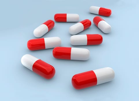 Medicine capsules on the blue background