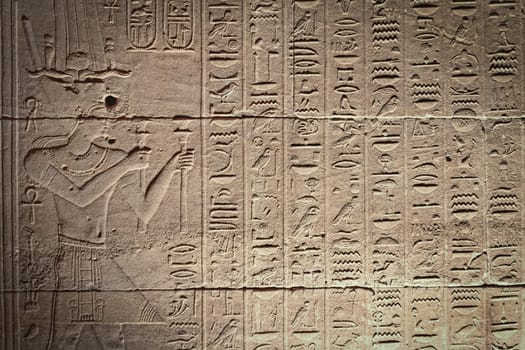 Old Egyptian hieroglyphs on an ancient background. Horizontally.