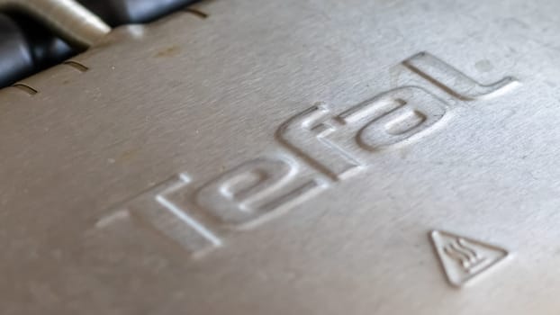 Tefal logo on electric grill. Stainless steel, special non-stick coating. Ukraine, Kyiv - October 9, 2022