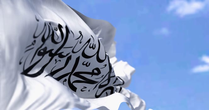 Flag of Islamic Emirate of Afghanistan waving in the wind on a clear day. 3d illustration render. Selective focus. Rippled fabric