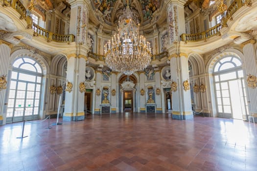 Italy, Stupinigi - January 2023: luxury interior of Royal Palace with baroque marbles and windows
