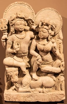 Turin, Italy - May 2023: Oriental Art Museum - Shiva, the Hindu god, with his wife Parvati. Concept for tantra, Kamasutra, tantric sex