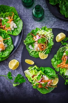 Asian minced meat lettuce wraps with rice, bean sprouts and cabbage