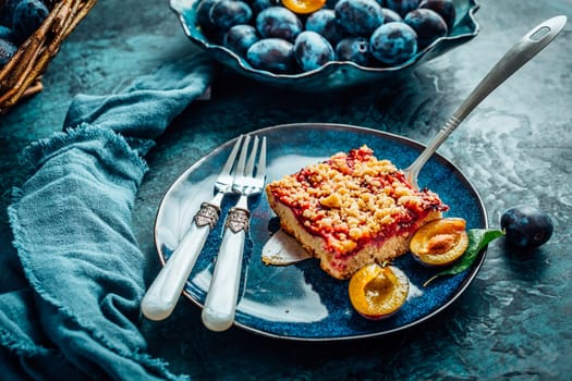 Homemade German plum cake (Zwetschgenkuchen) with yeast dough and crumbles