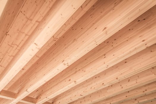Detail of wooden roof with beams, background