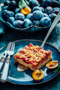 Homemade vegan German plum cake (Zwetschgenkuchen) with yeast dough and crumbles