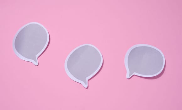 Blank paper stickers in cloud shape on pink background