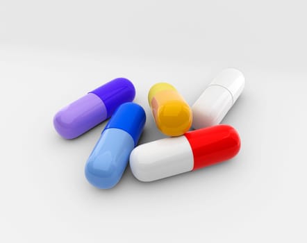 Pile of colorful pills, tablets and capsules on a white background