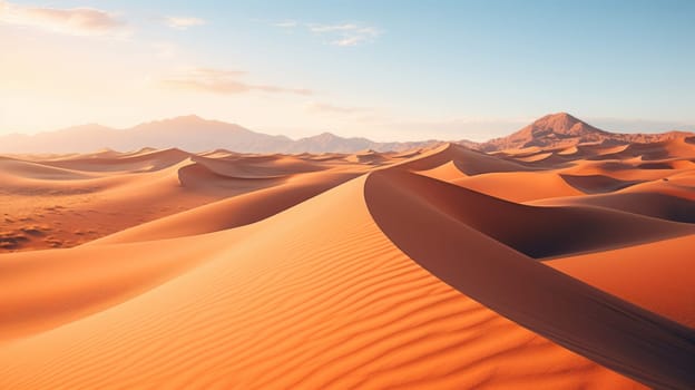 Desert with sand dunes and mountains in the background