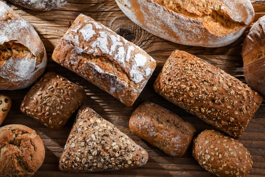 Assorted bakery products including loaves of bread and rolls