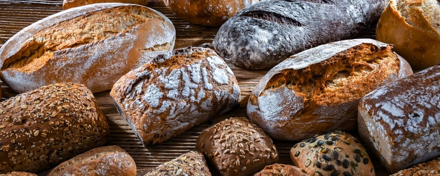 Assorted bakery products including loaves of bread and rolls