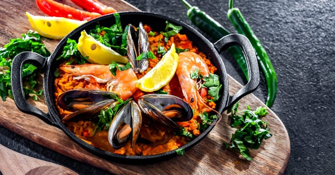 Seafood paella served in a cast iron pan.