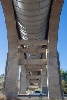 Vehicule crossing under Acedera Aqueduct through N430 National Road. Motion blurred