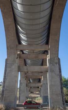 Vehicule crossing under Acedera Aqueduct through N430 National Road. Motion blurred