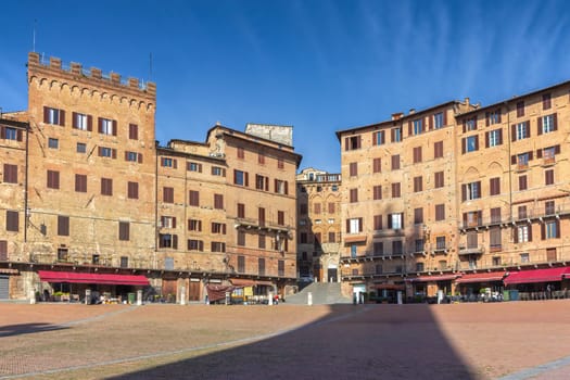 Famous empty Square (Piazza del Campo) in Siena, Tuscany (Italy). Shot from the  Torre del Mangia .  Horizontally.